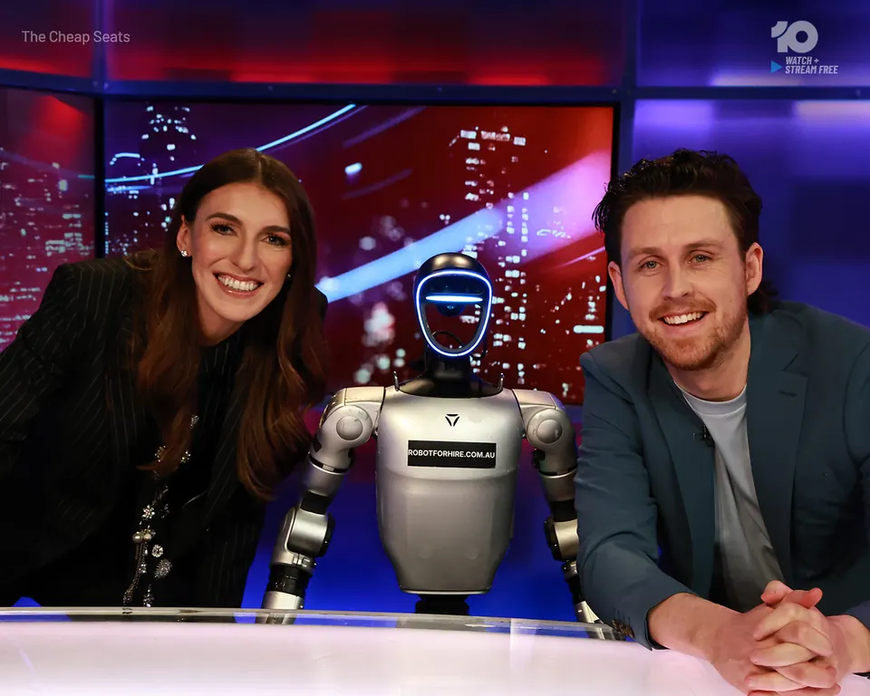 Rocco the humanoid robot at the desk with hosts Mel and Tim on Channel 10's The Cheap Seats